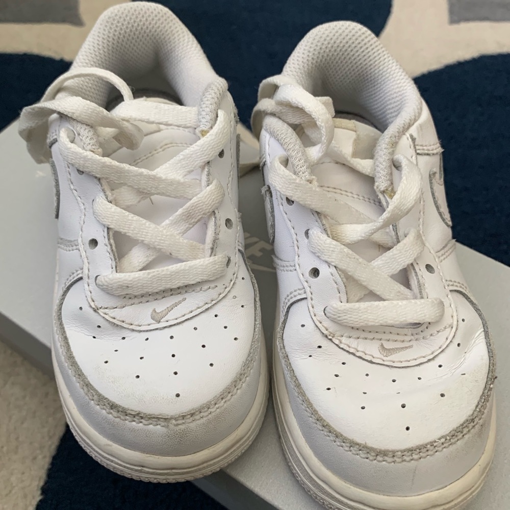 white Nike leather sneakers